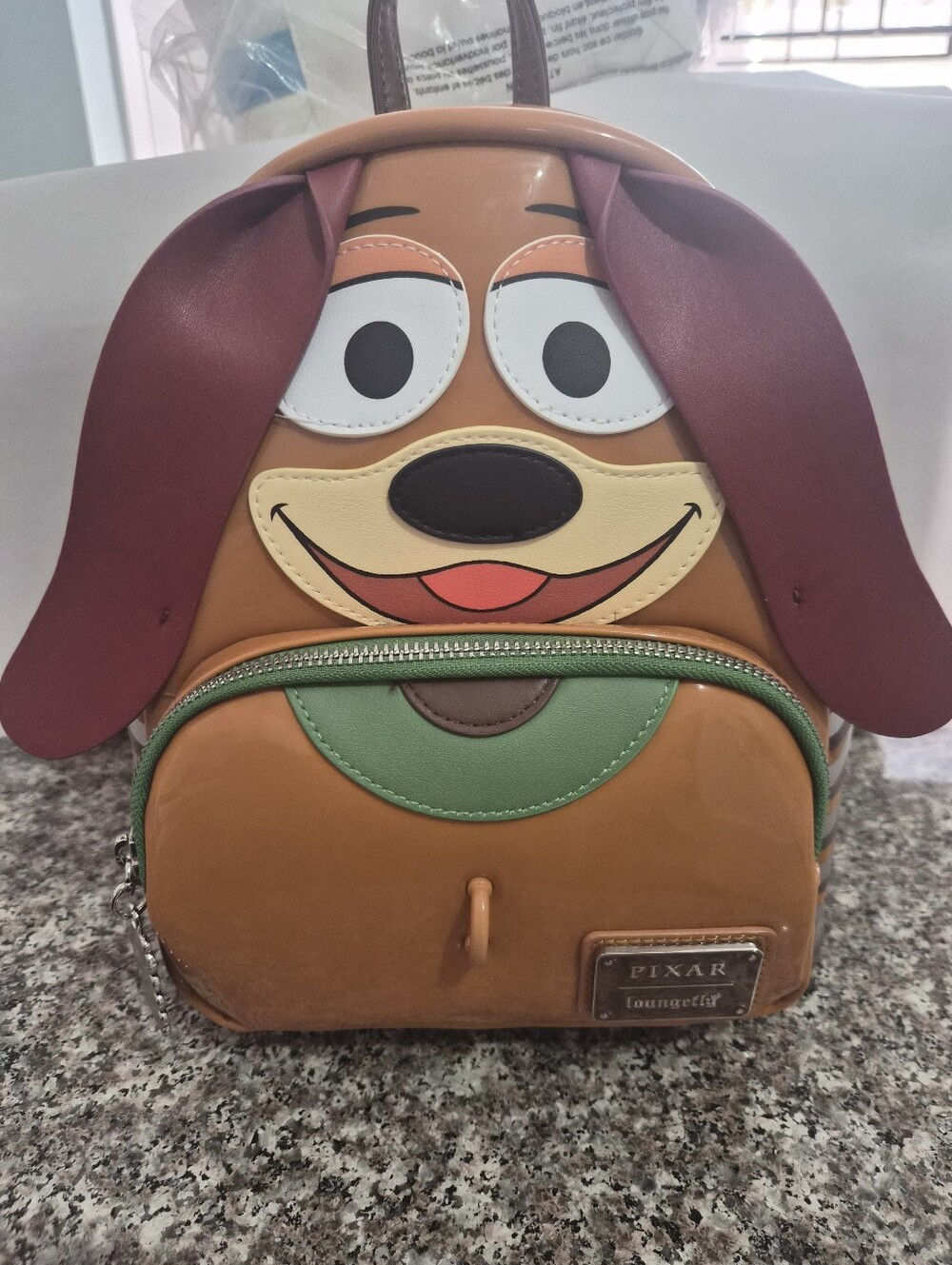 Loungefly Toy Story Slinky Mini Backpack with Maroon Ears and Green Trim